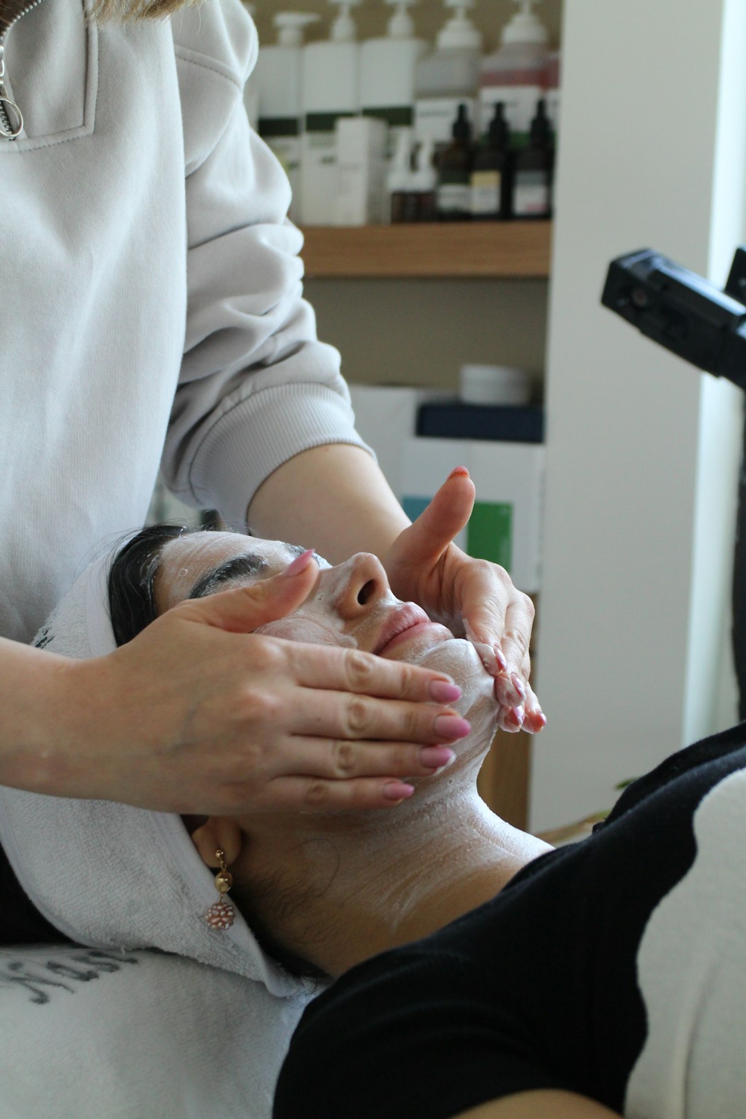 about-img-01 a-woman-getting-a-facial-mask-on-her-face-u93ntfwqr9w
